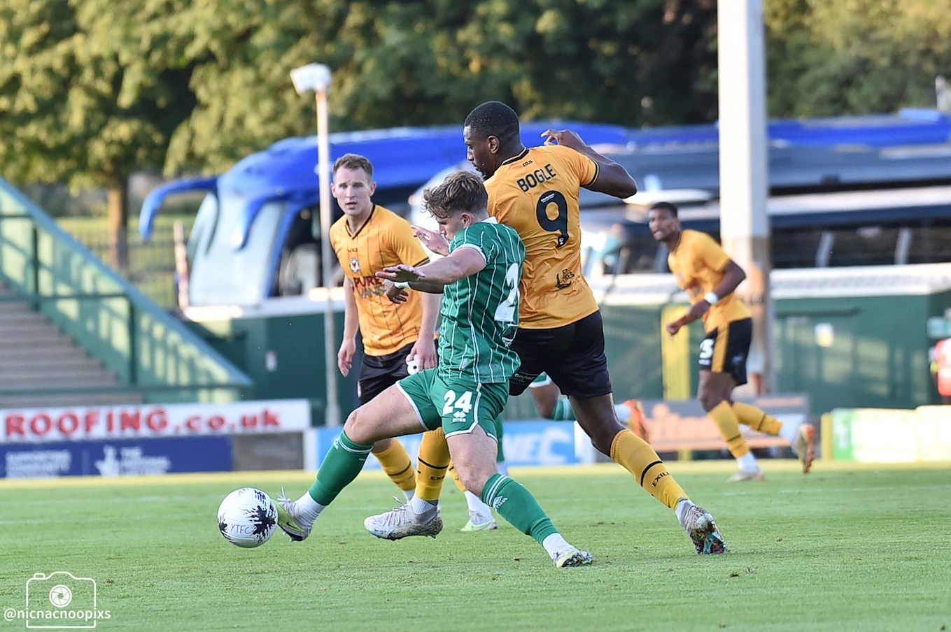 Omar Bogle challenging for the ball.